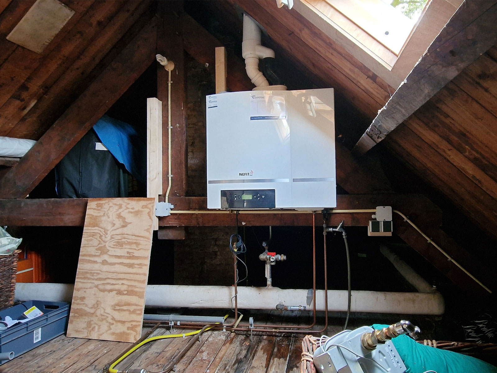 Attic of historic house in Berlicum with traditional central heating boiler