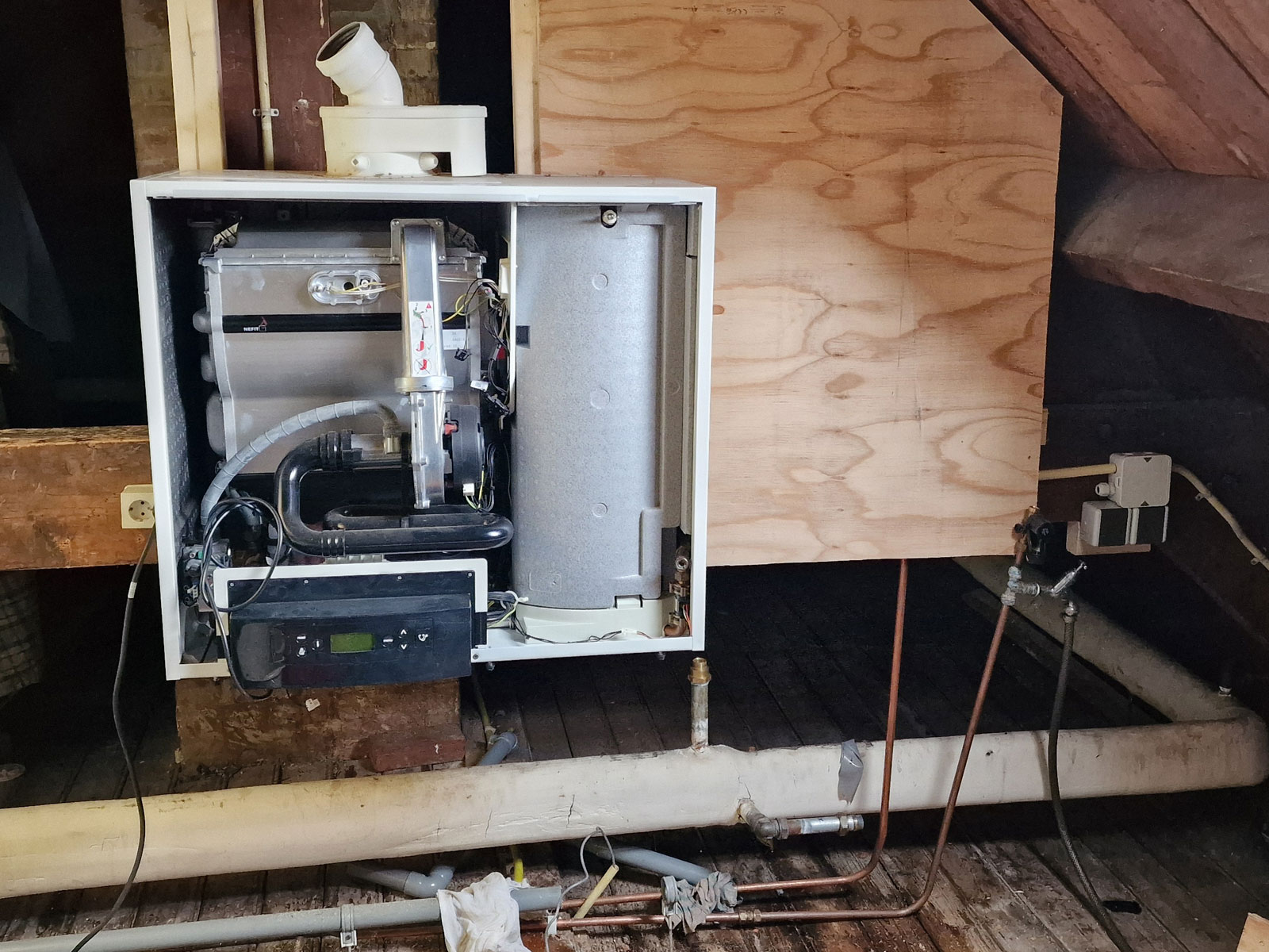 Relocating the central heating boiler to make room for the adsorption heat pump